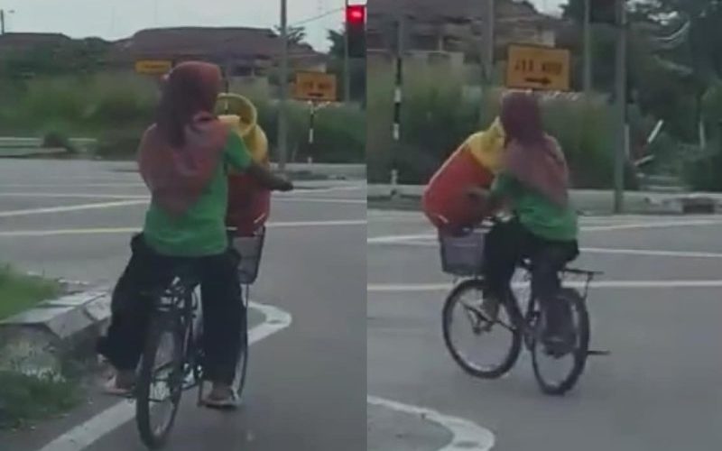 Wanita angkut tong gas naik basikal di jalan raya buat ramai cemas
